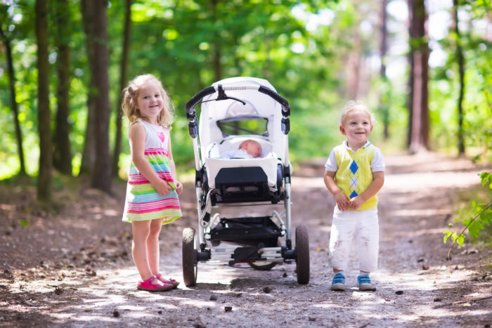 Posing with an expensive stroller